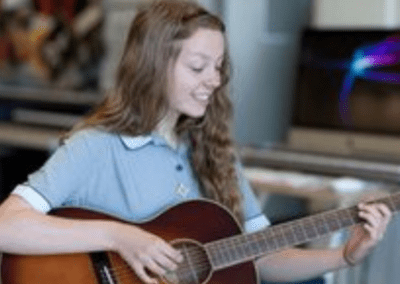 Girl learning guitar